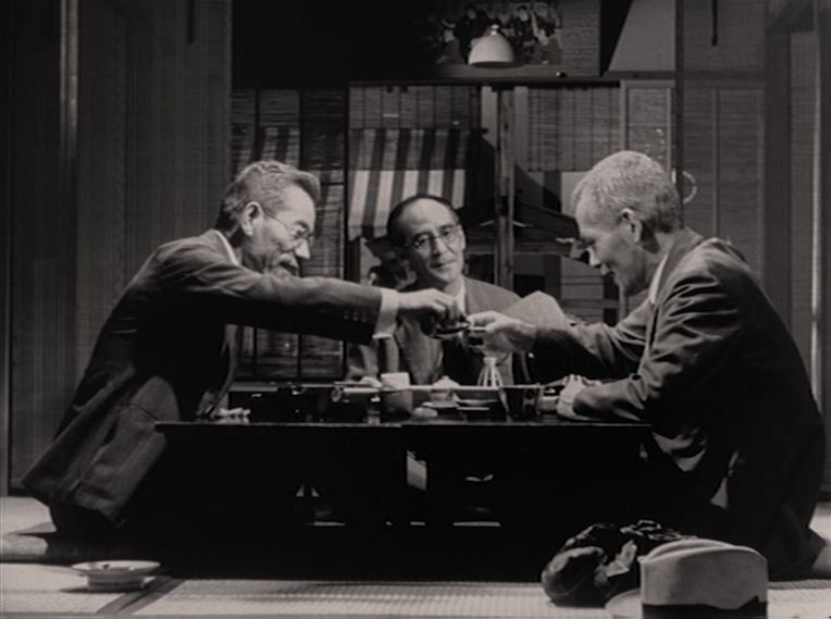 Three men drinking.